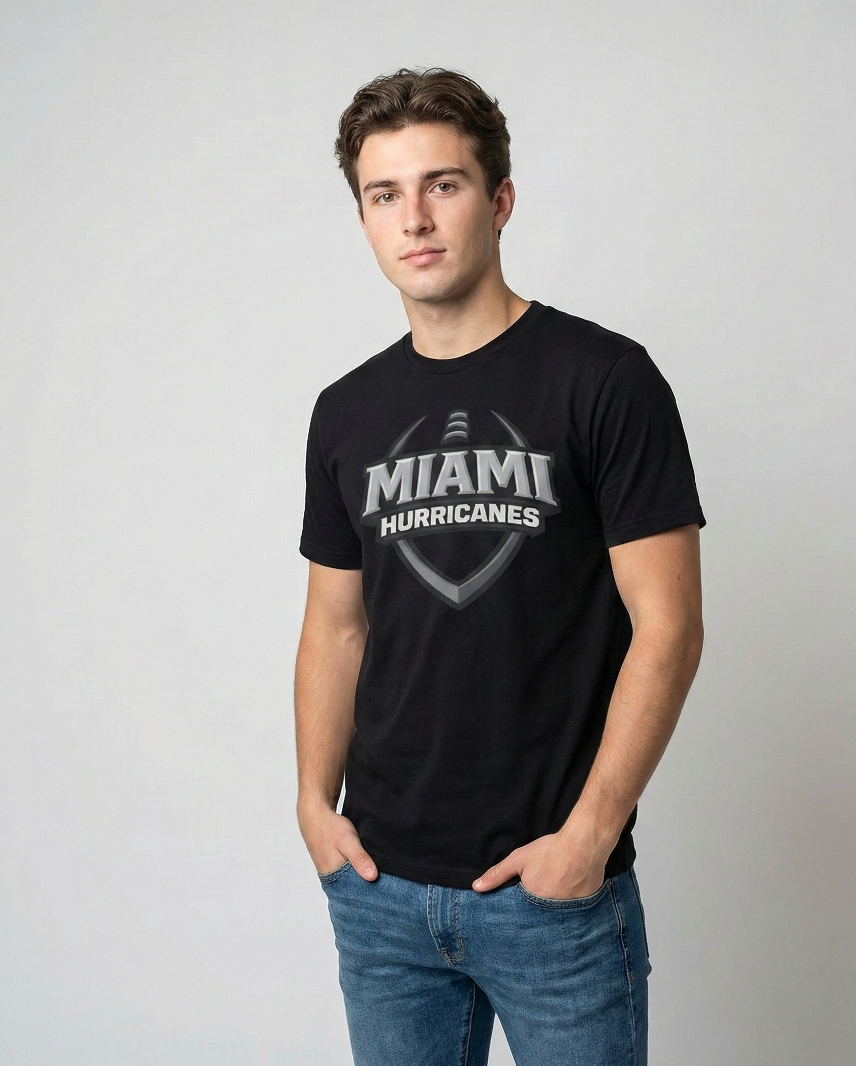 Man wearing a black 'Miami Hurricanes' t-shirt against a plain background